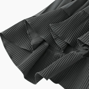Asymmetrisk plisserad kjol med volanger
