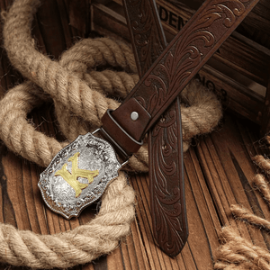Cowboybälte med gyllene bokstav