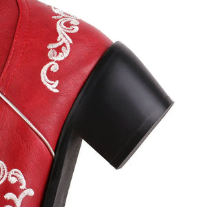 Cowboyboots med broderad skelettdesign och chunky klack