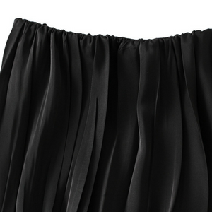 Plisserad satinkjol
