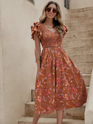 Blommig klänning med volanger