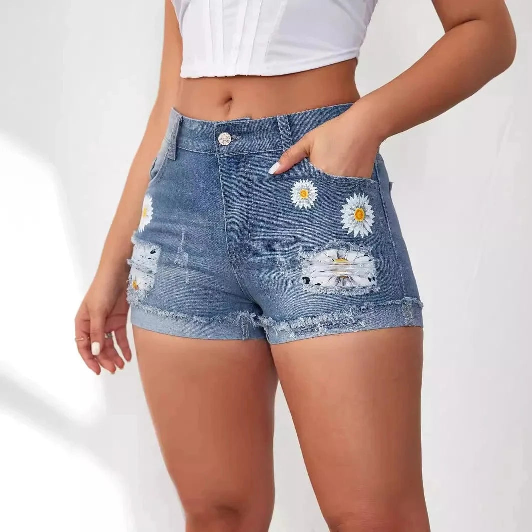 Broderade jeansshorts med blommor