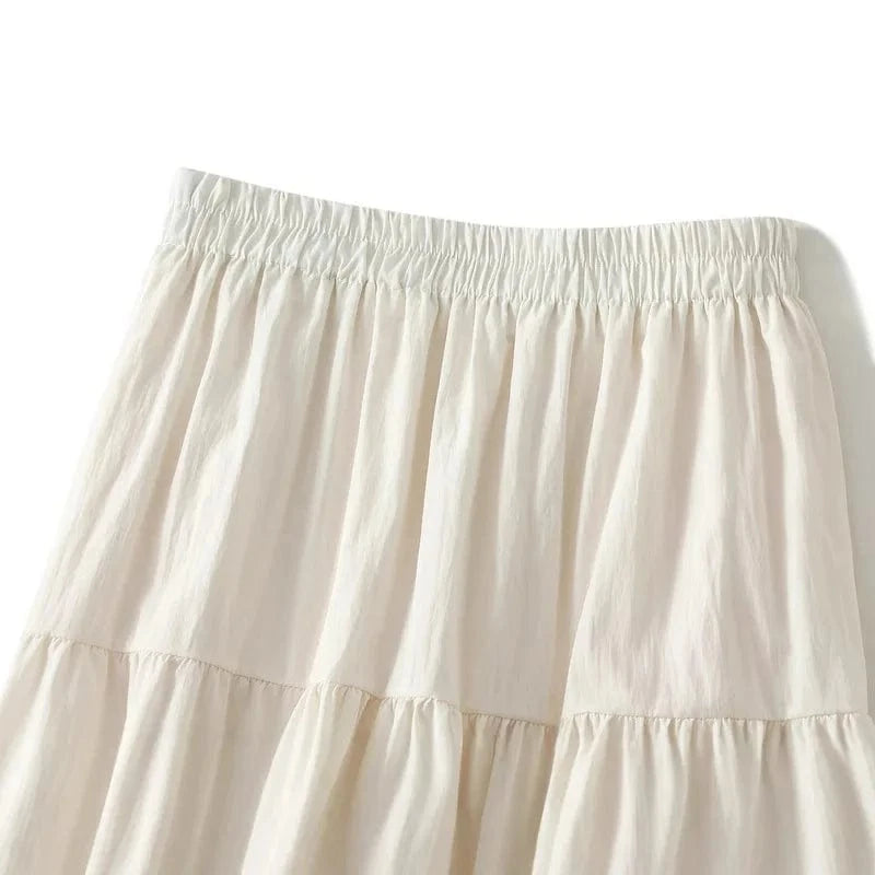 Lång kjol med volanger och spetsdetaljer