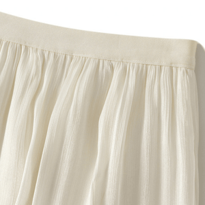 Midikjol med asymmetrisk drapering