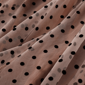 Tyllkjol med svarta prickar